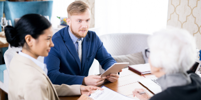 insurance agents with senior woman EACZLJR 1